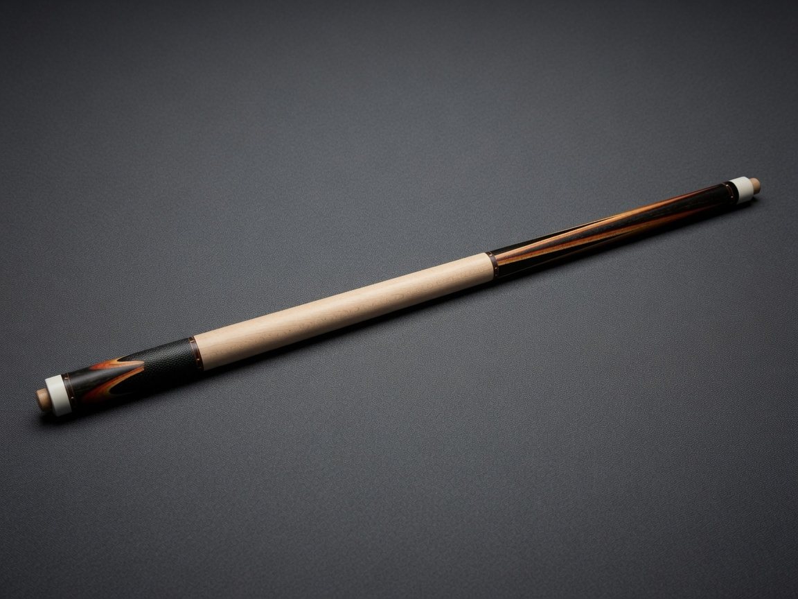 Custom cue with exotic forearm and leather wrap on a dark surface
